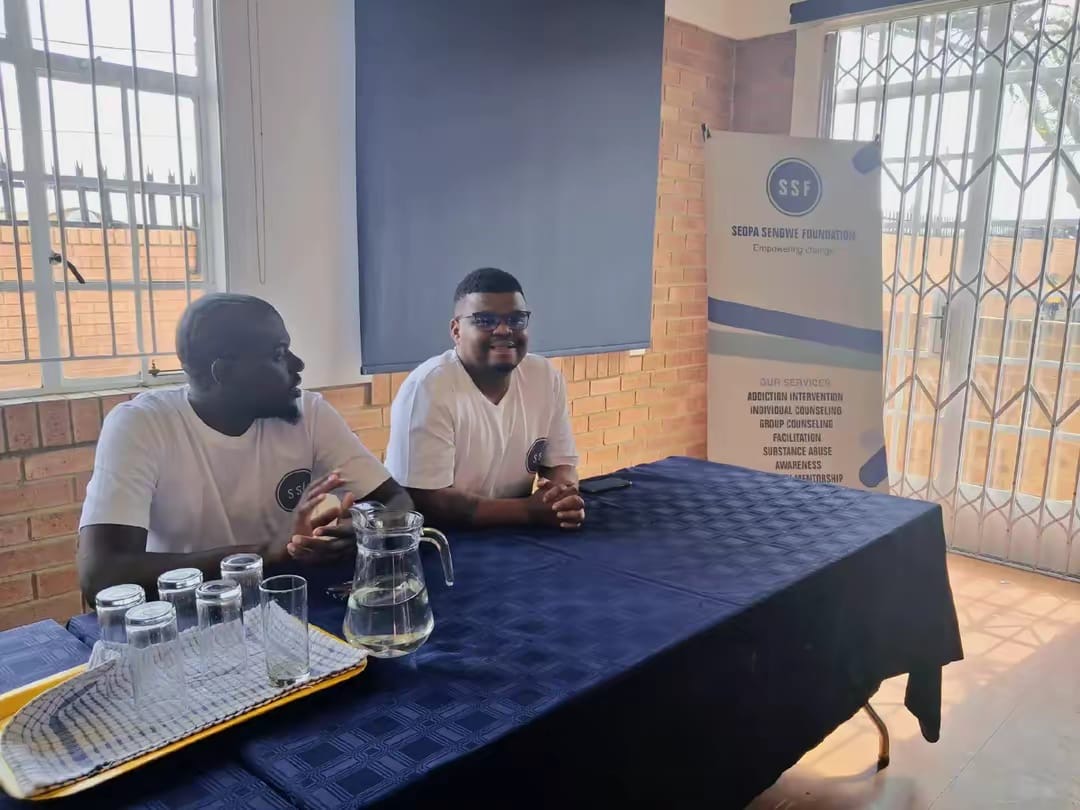 Two SSF facilitators at a community outreach session table