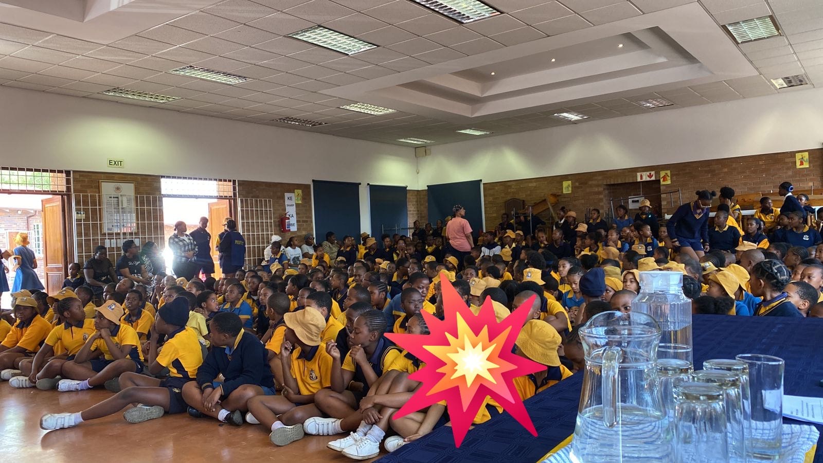 Primary school learners seated together during an SSF awareness talk